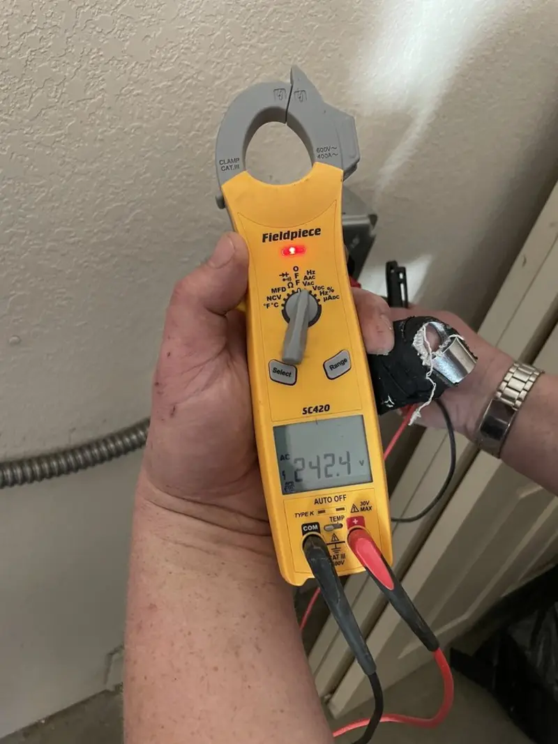 Voltage testing with clamp meter during Whole House Surge Protector in Margaret
